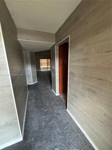 a view of a backyard with a small garden