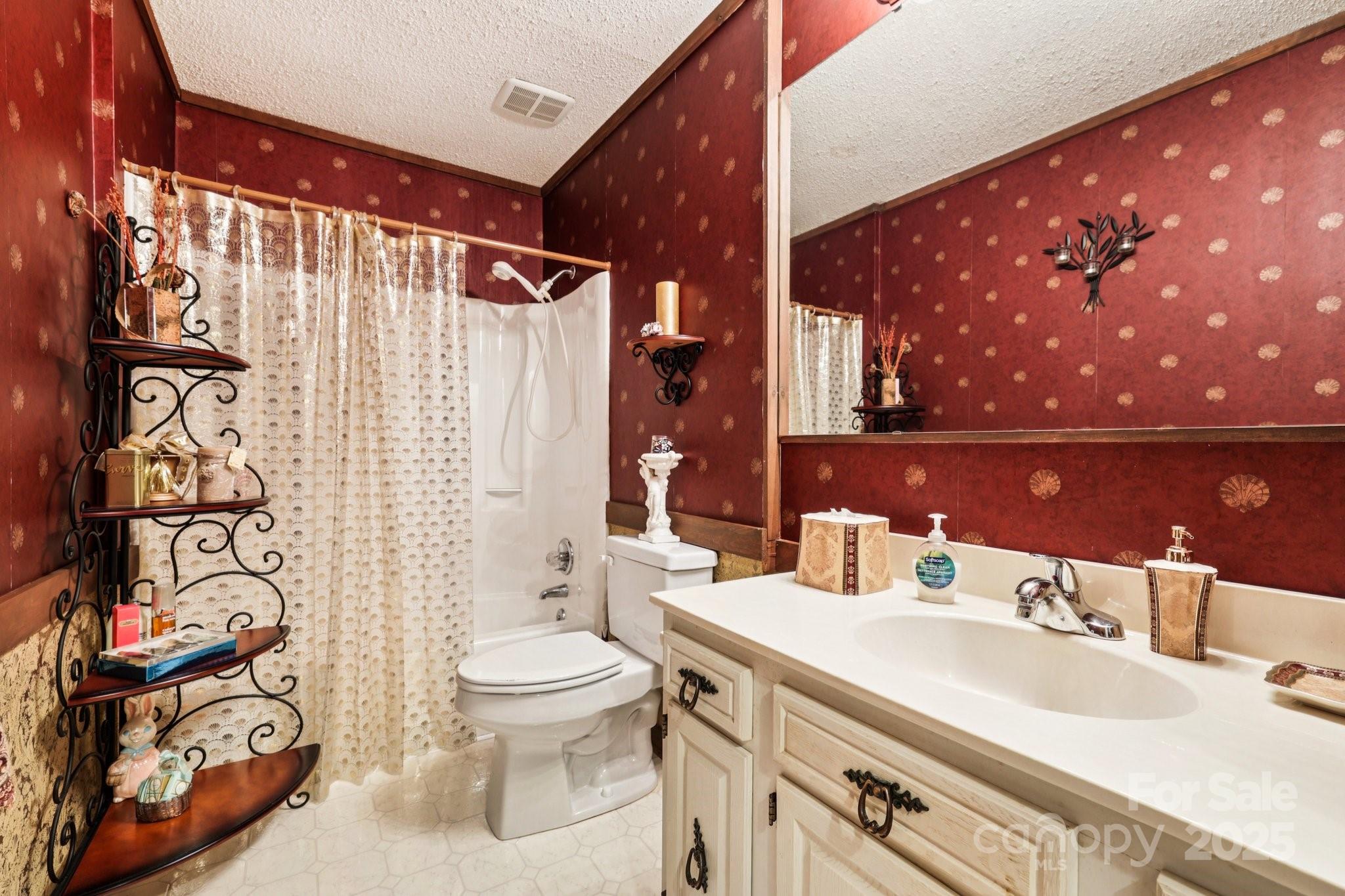 27 Search Drive Concord, NC 28025 - Photo 17 of 26 a bathroom with a sink vanity mirror and toilet