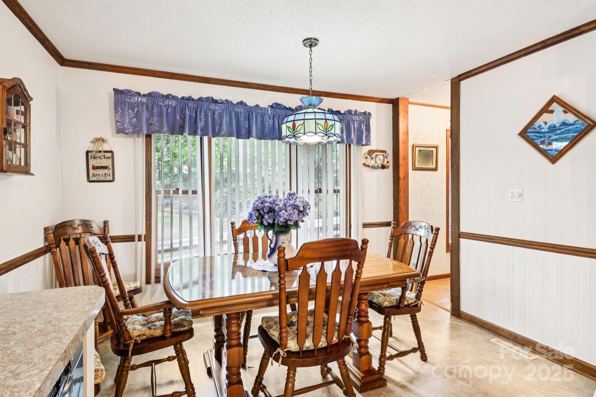 27 Search Drive Concord, NC 28025 - Photo 8 of 26 a view of a dining room with furniture window and outside view