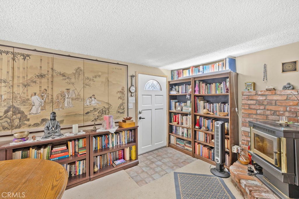 23328 Brookside Road Crestline, CA 92325 - Photo 14 of 40 a living room with lots of books