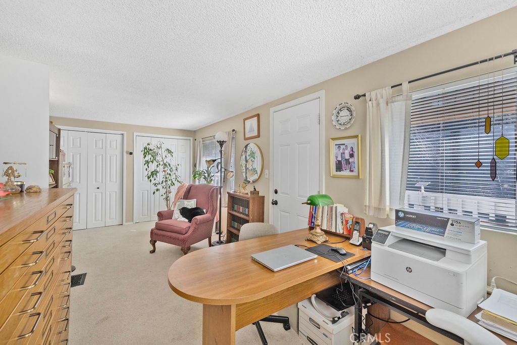 23328 Brookside Road Crestline, CA 92325 - Photo 20 of 40 a living room with furniture and a table