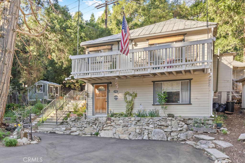 23328 Brookside Road Crestline, CA 92325 - Photo 2 of 40 a front view of a house with garden