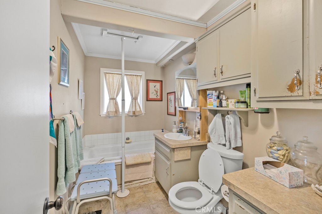 23328 Brookside Road Crestline, CA 92325 - Photo 23 of 40 a bathroom with a toilet sink and mirror