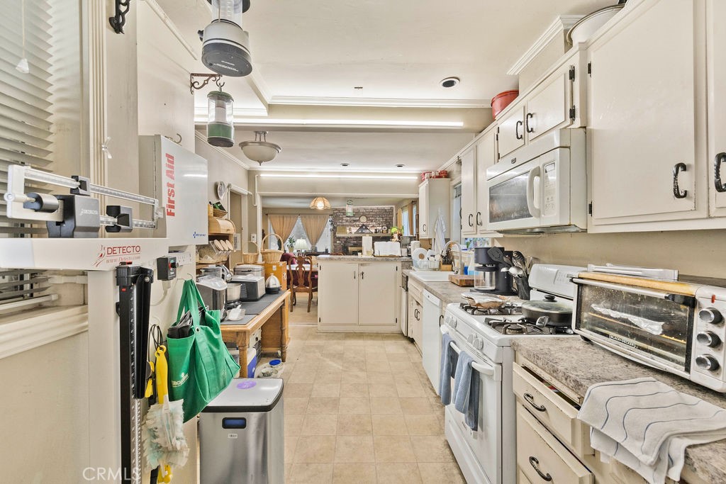 23328 Brookside Road Crestline, CA 92325 - Photo 26 of 40 a kitchen with appliances a stove a sink and cabinets
