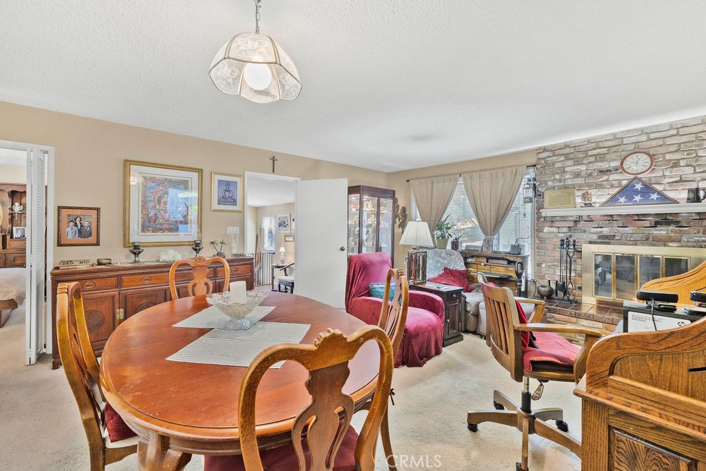 23328 Brookside Road Crestline, CA 92325 - Photo 27 of 40 a view of a dining room with furniture and a chandelier