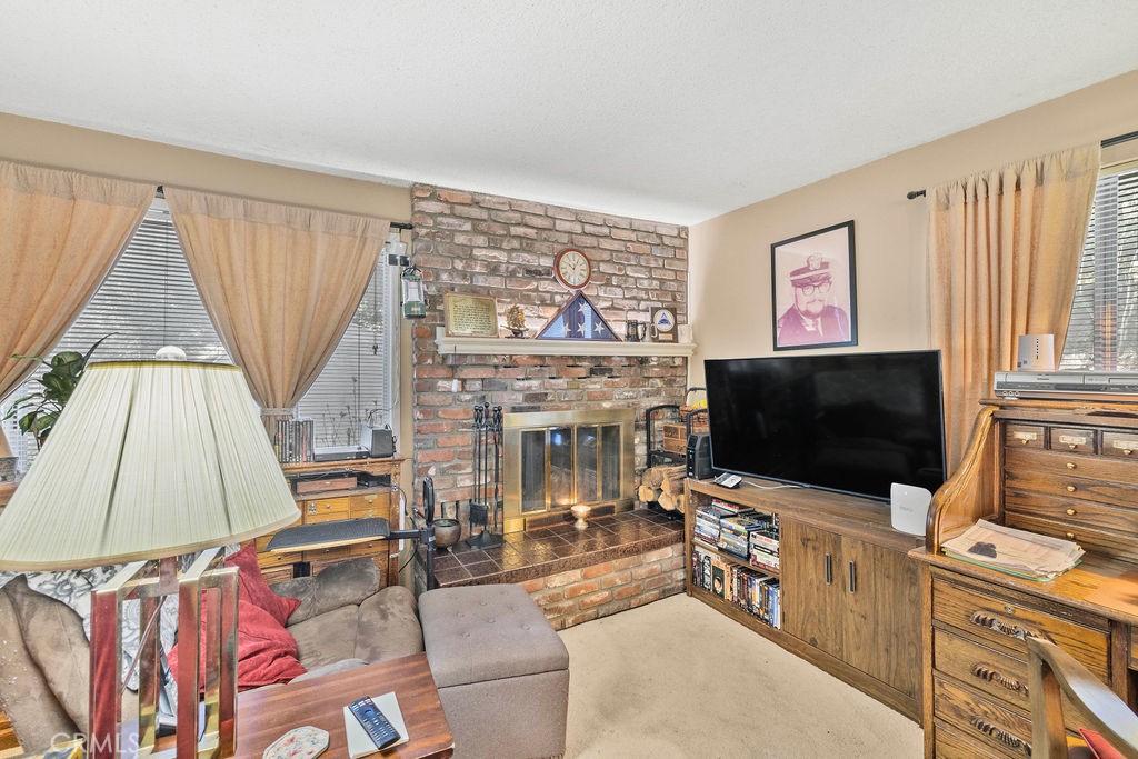 23328 Brookside Road Crestline, CA 92325 - Photo 28 of 40 a living room with furniture and a flat screen tv