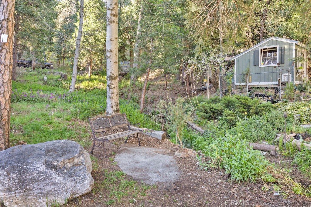 23328 Brookside Road Crestline, CA 92325 - Photo 6 of 40 a view of a chairs in a backyard