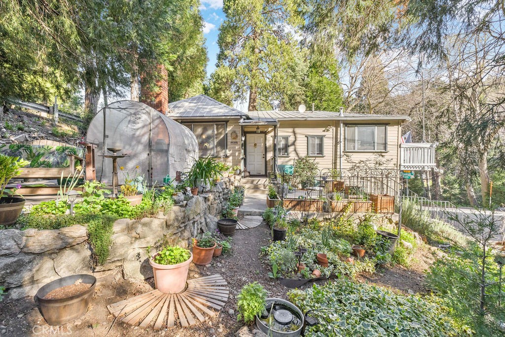 23328 Brookside Road Crestline, CA 92325 - Photo 10 of 40 a view of a patio with table and chairs and potted plants
