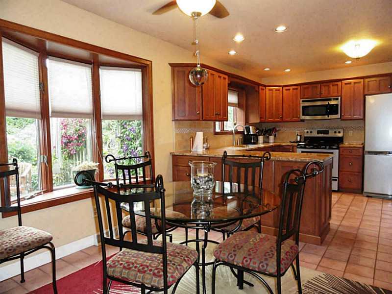 Kitchen. Breakfast Area with bow window overlooking the private back yard