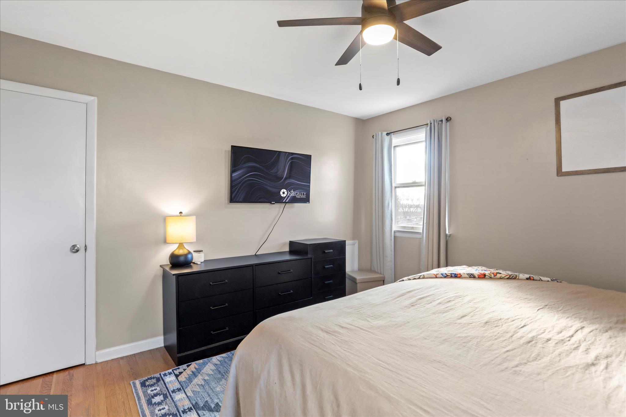 4402 Shatzer Street Chambersburg, PA 17202 - Photo 13 of 30 a bedroom with a bed and a chandelier