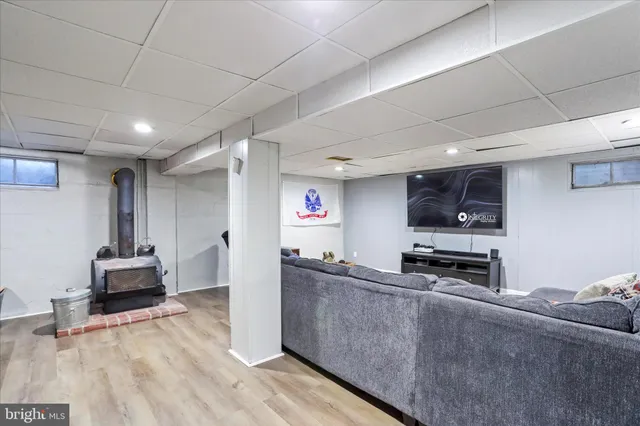 a kitchen with stainless steel appliances a stove a sink a refrigerator and cabinets