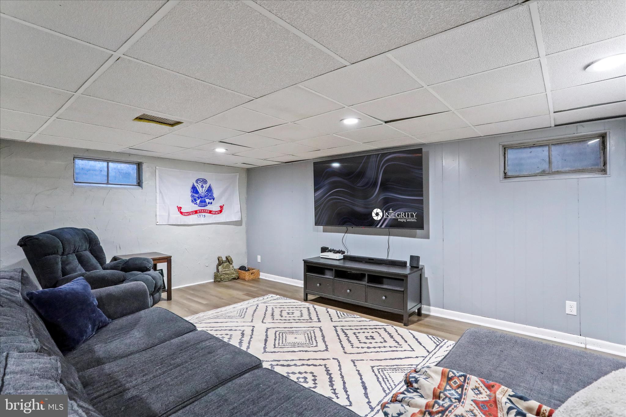4402 Shatzer Street Chambersburg, PA 17202 - Photo 22 of 30 a living room with furniture and a flat screen tv