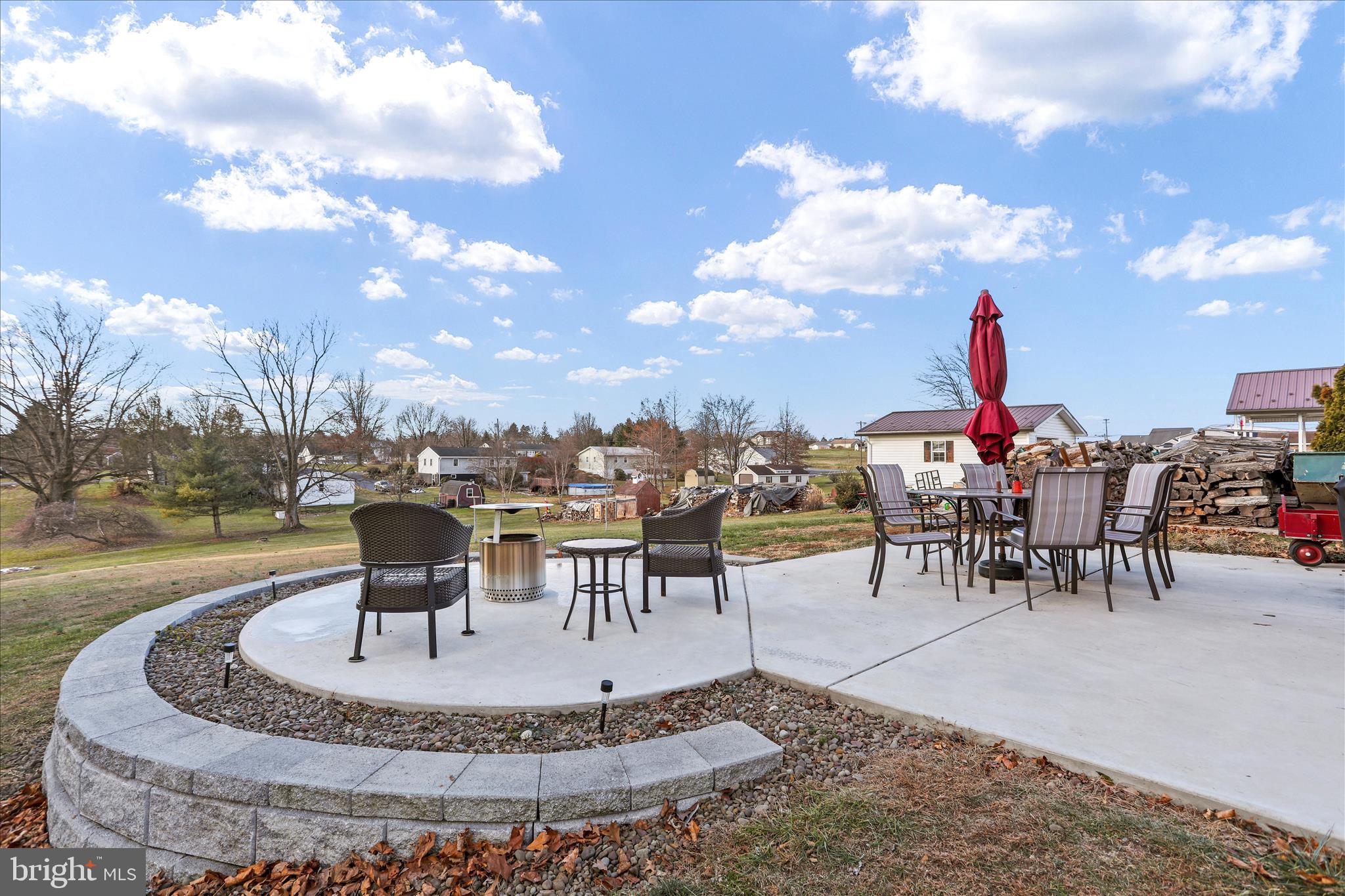 4402 Shatzer Street Chambersburg, PA 17202 - Photo 25 of 30 a view of a swimming pool with table and chairs