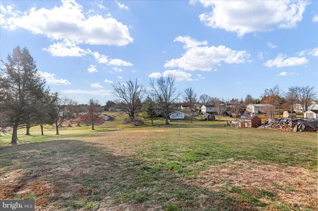 a view of a house with a big yard