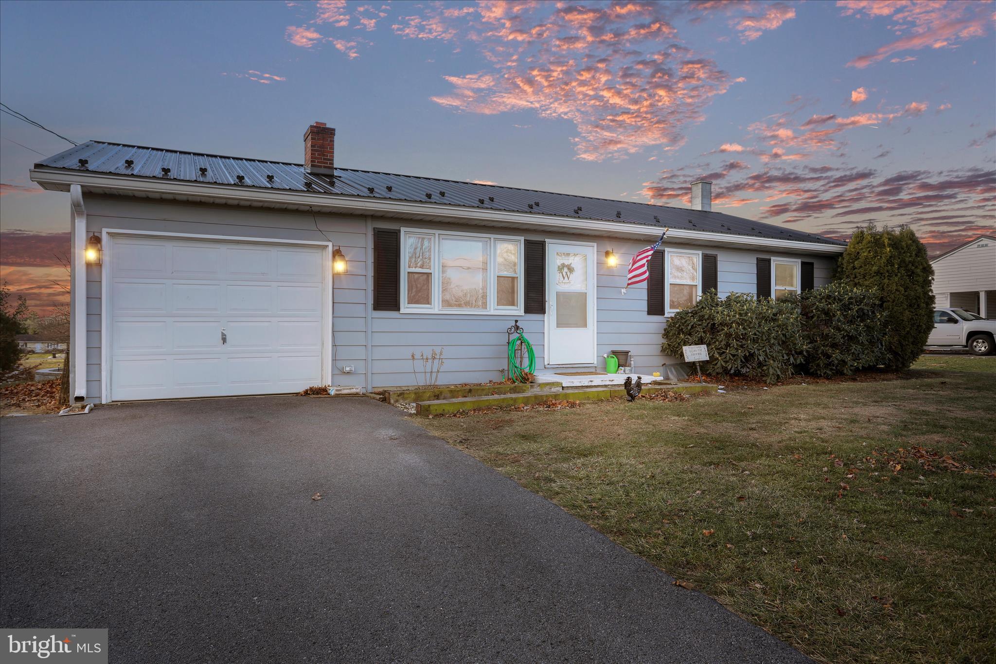 4402 Shatzer Street Chambersburg, PA 17202 - Photo 3 of 30 a front view of a house with a yard