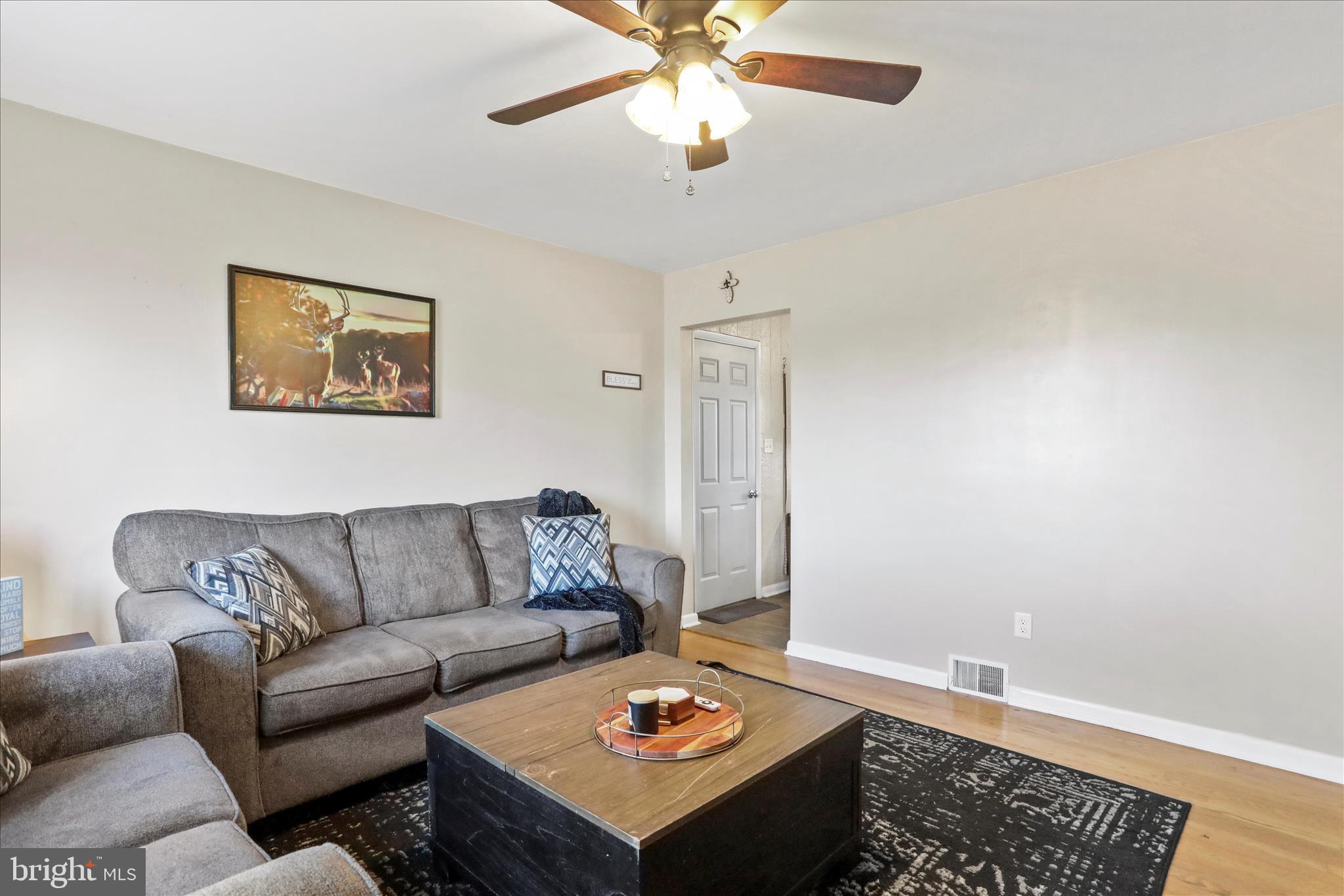 4402 Shatzer Street Chambersburg, PA 17202 - Photo 5 of 30 a living room with furniture and a rug