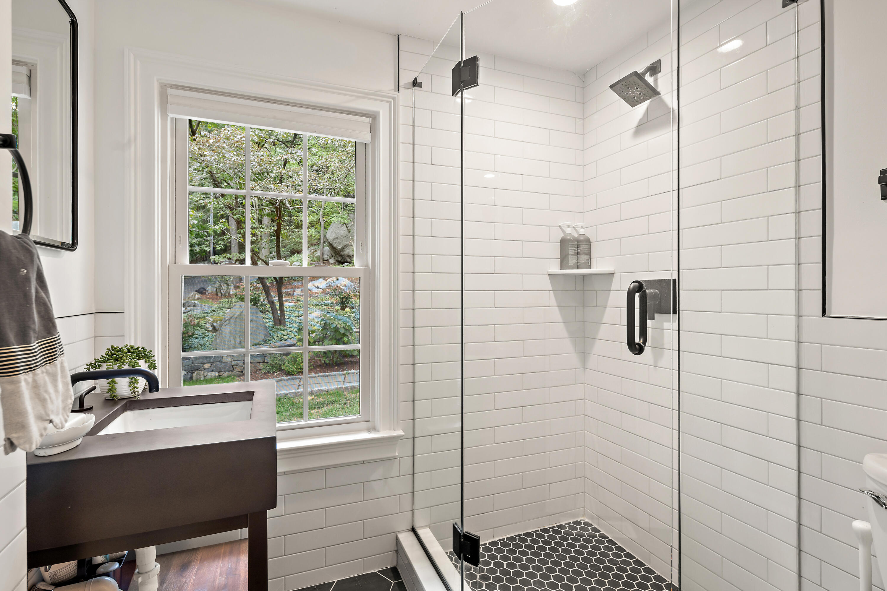 69 Mariomi Road New Canaan, CT 06840 - Photo 18 of 30 a bathroom with a sink and a shower