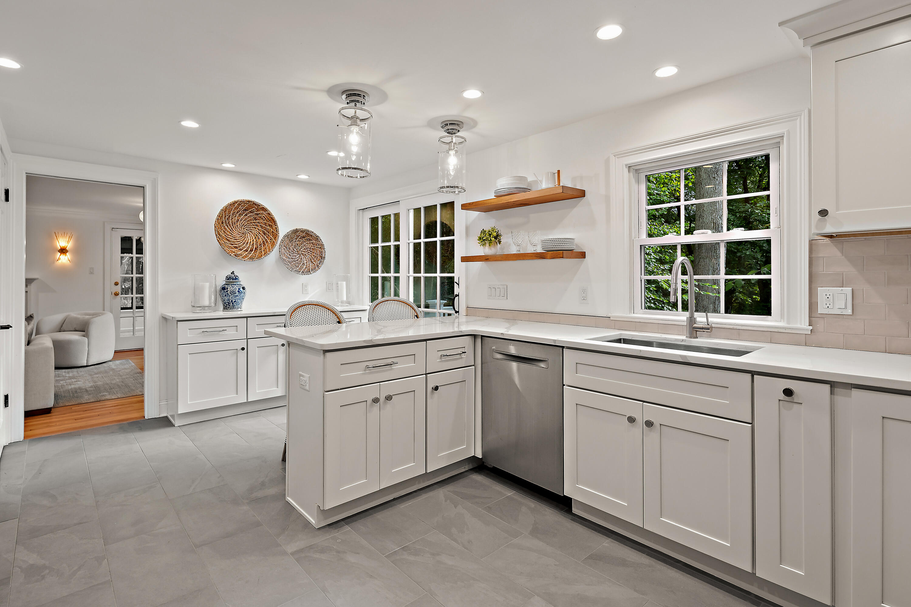 69 Mariomi Road New Canaan, CT 06840 - Photo 10 of 30 a kitchen with granite countertop a sink a stove and cabinets