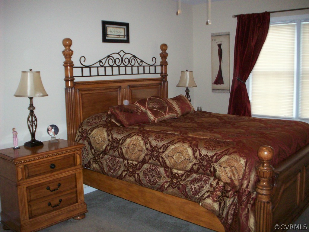 15813 Sandwave Road Chester, VA 23831 - Photo 11 of 24 a bedroom with a bed and a window