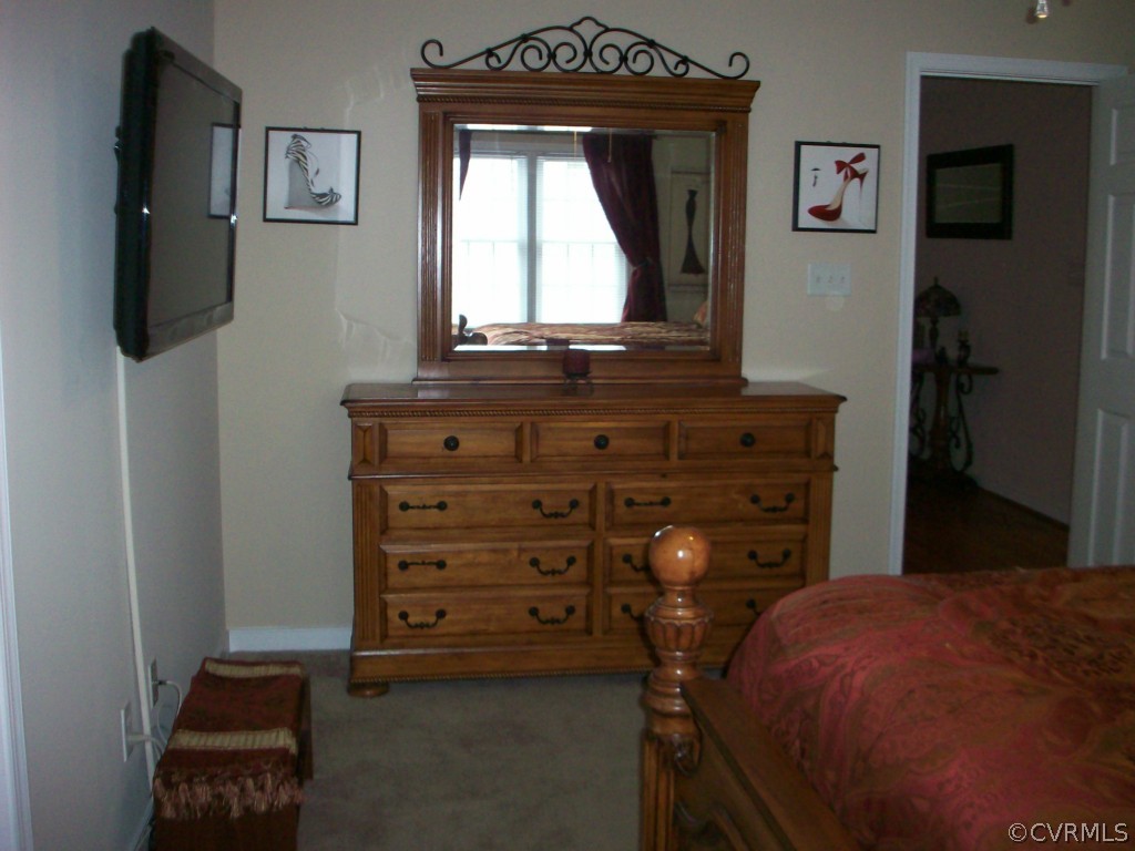 15813 Sandwave Road Chester, VA 23831 - Photo 12 of 24 a living room with furniture and a window