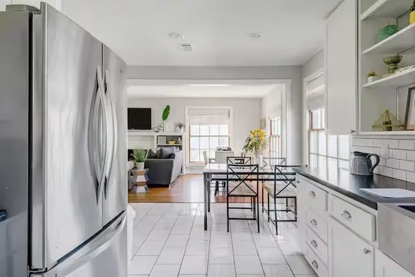 a view of a kitchen and dining room
