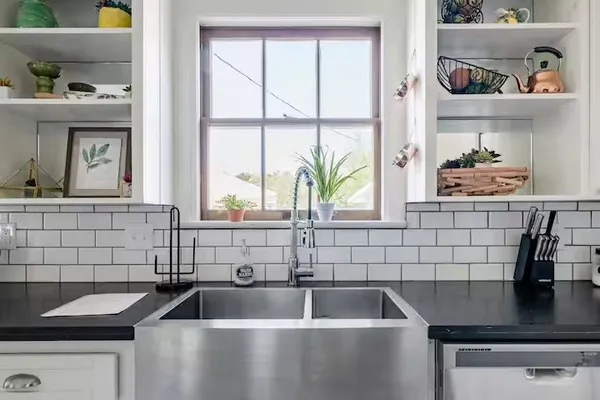 a kitchen with a sink and a window