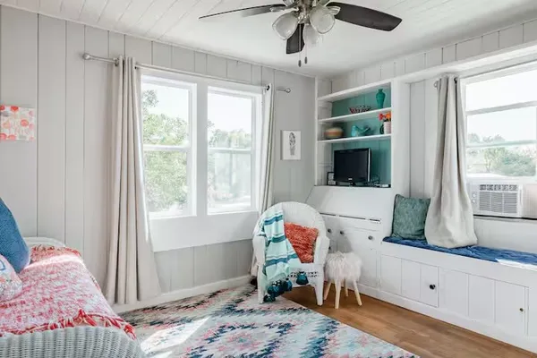 a bedroom with a bed and a lamp