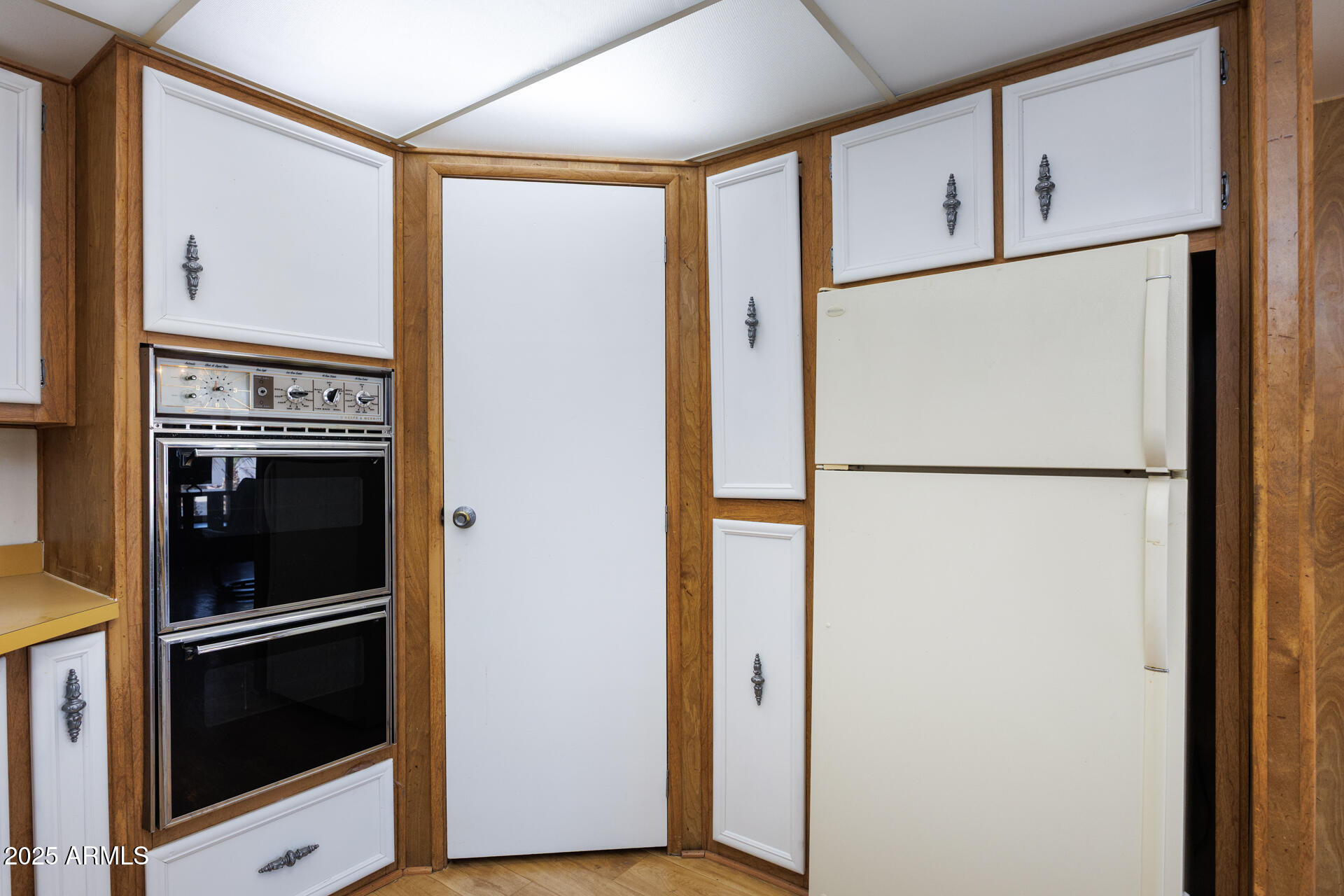 2100 North Trekell Road, Unit 144 Casa Grande, AZ 85122 - Photo 11 of 36 a white refrigerator freezer and a stove sitting inside of a kitchen