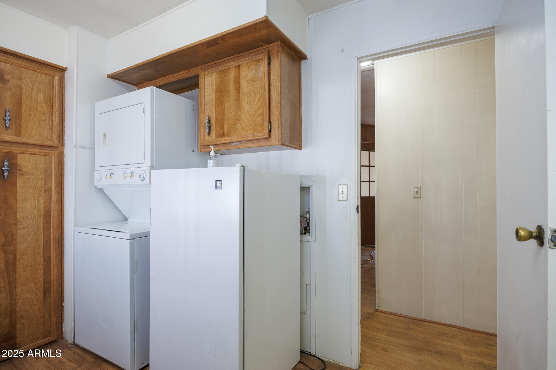 2100 North Trekell Road, Unit 144 Casa Grande, AZ 85122 - Photo 12 of 36 a white refrigerator freezer sitting inside of a kitchen