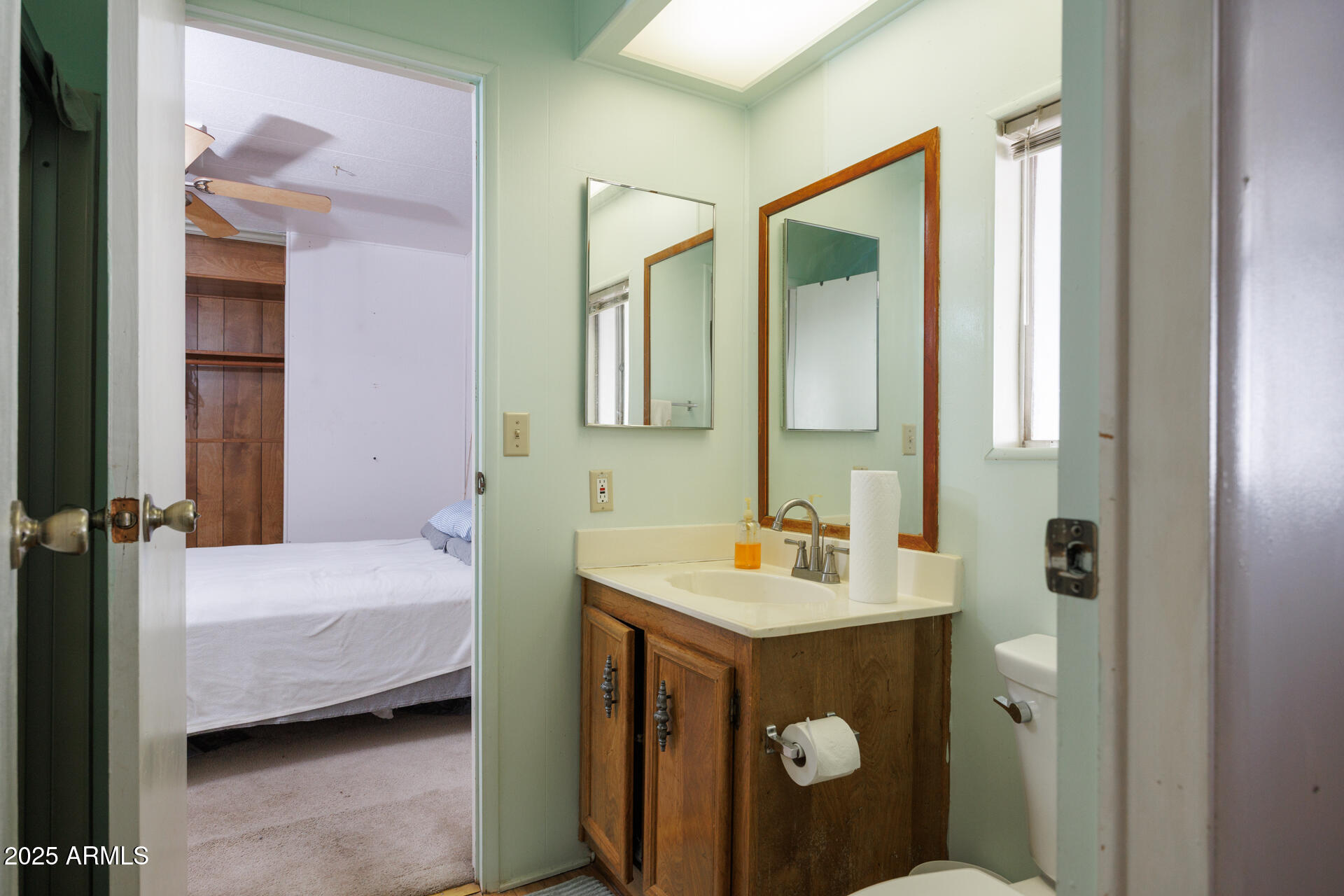2100 North Trekell Road, Unit 144 Casa Grande, AZ 85122 - Photo 13 of 36 a bathroom with a sink and a mirror