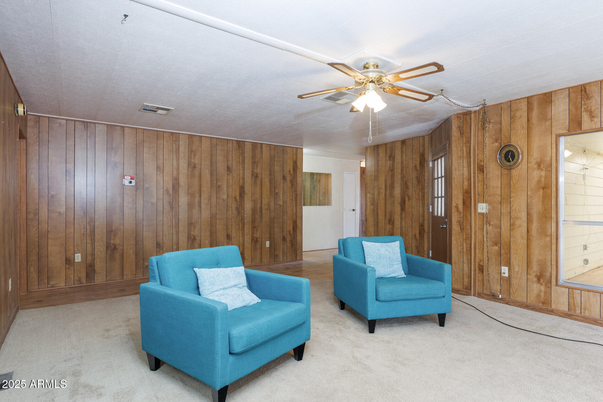 2100 North Trekell Road, Unit 144 Casa Grande, AZ 85122 - Photo 18 of 36 a living room with furniture and a chandelier