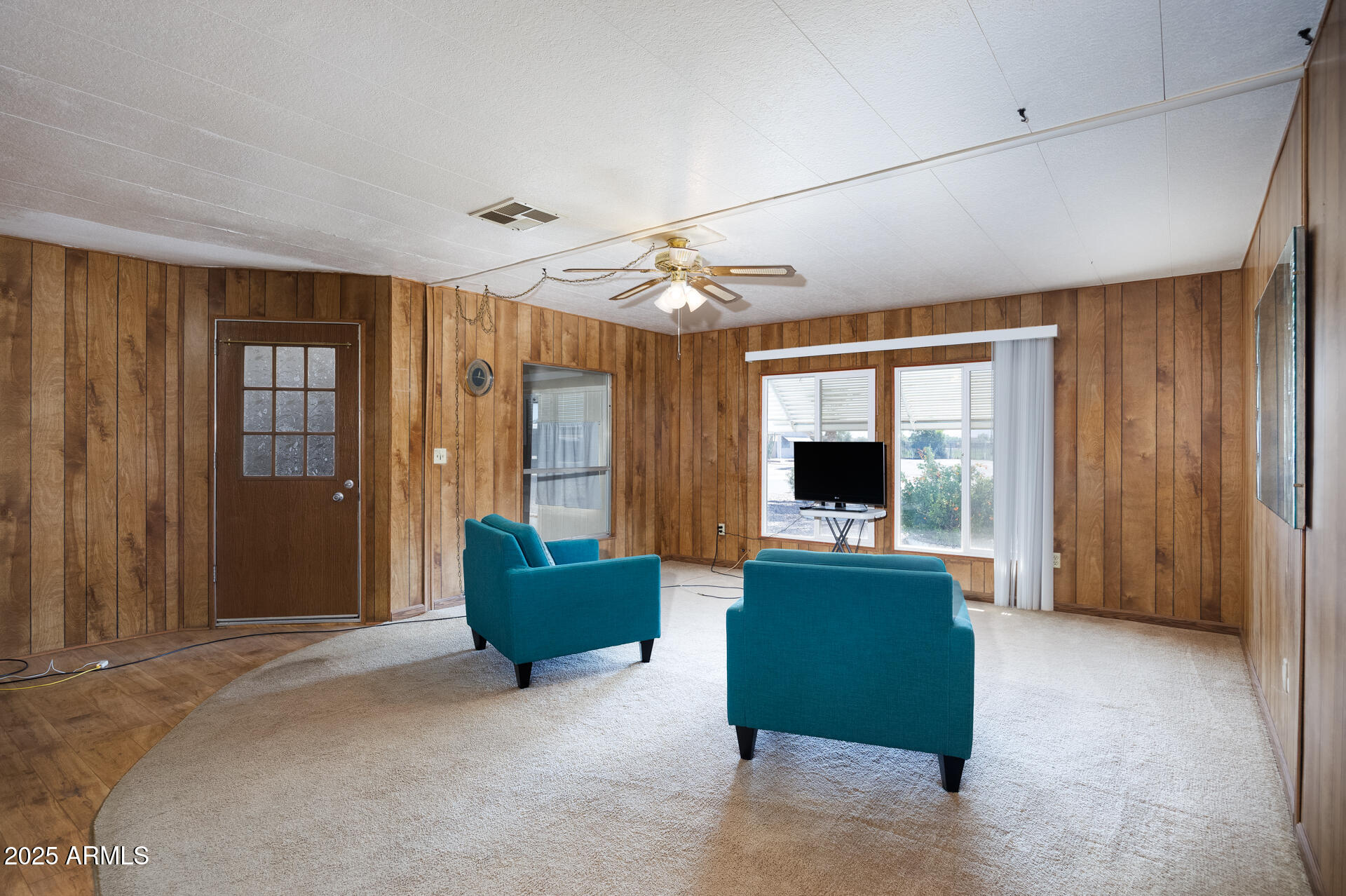 2100 North Trekell Road, Unit 144 Casa Grande, AZ 85122 - Photo 19 of 36 a living room with furniture and a large window