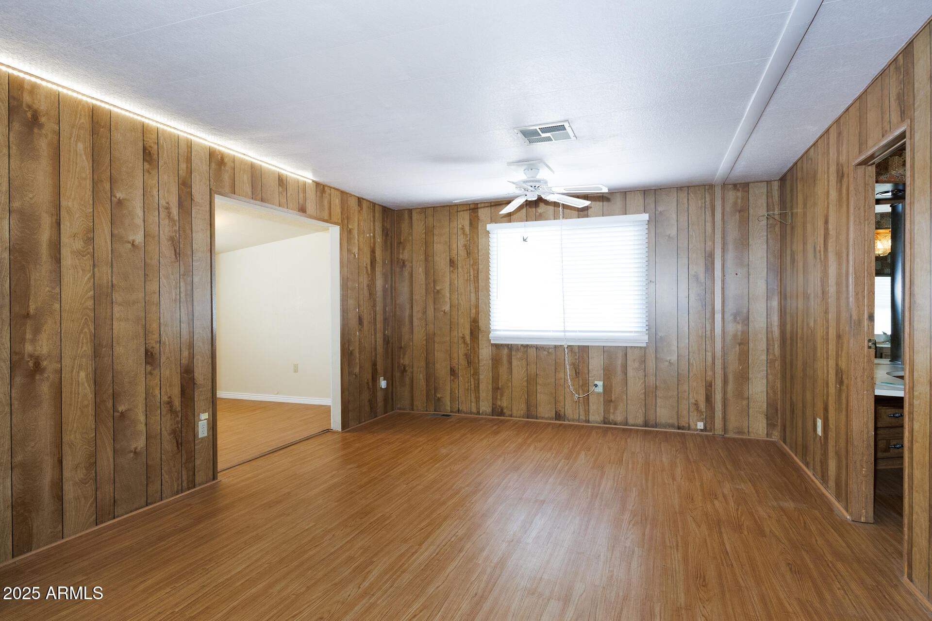 2100 North Trekell Road, Unit 144 Casa Grande, AZ 85122 - Photo 27 of 36 wooden floor in an empty room with a window