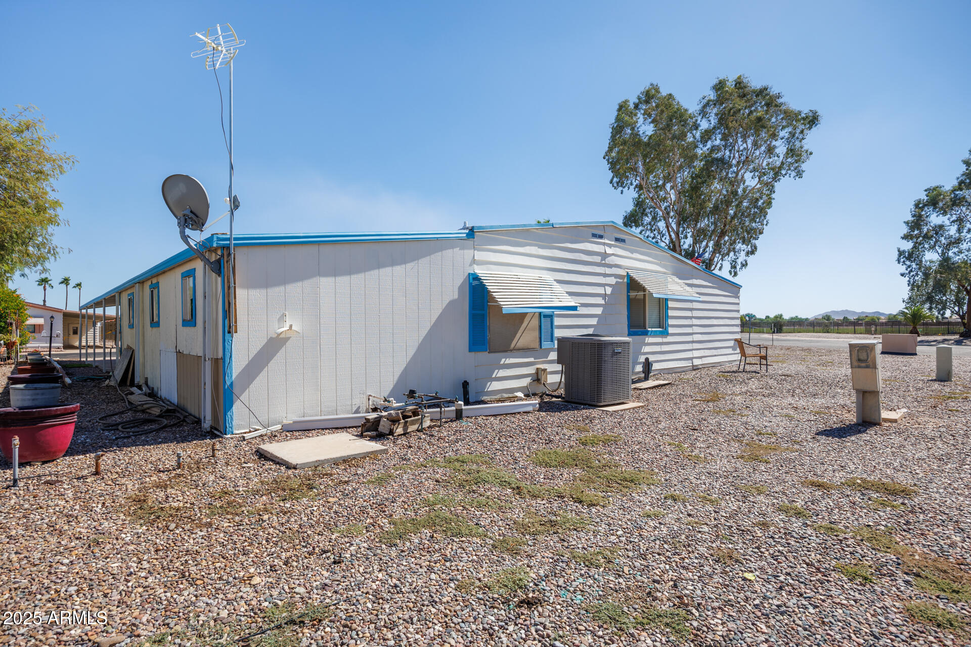 2100 North Trekell Road, Unit 144 Casa Grande, AZ 85122 - Photo 34 of 36 a view of a house with a snow in the yard