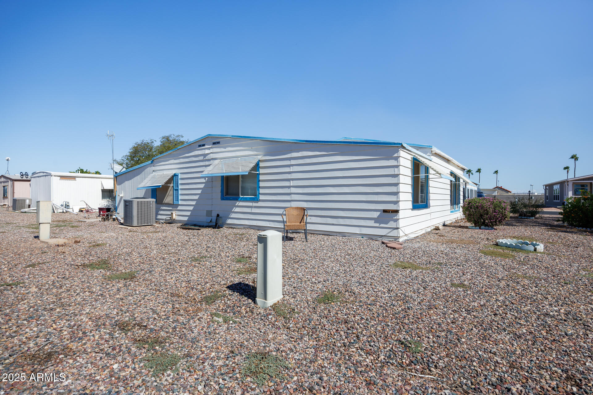 2100 North Trekell Road, Unit 144 Casa Grande, AZ 85122 - Photo 36 of 36 a front view of a house with a yard
