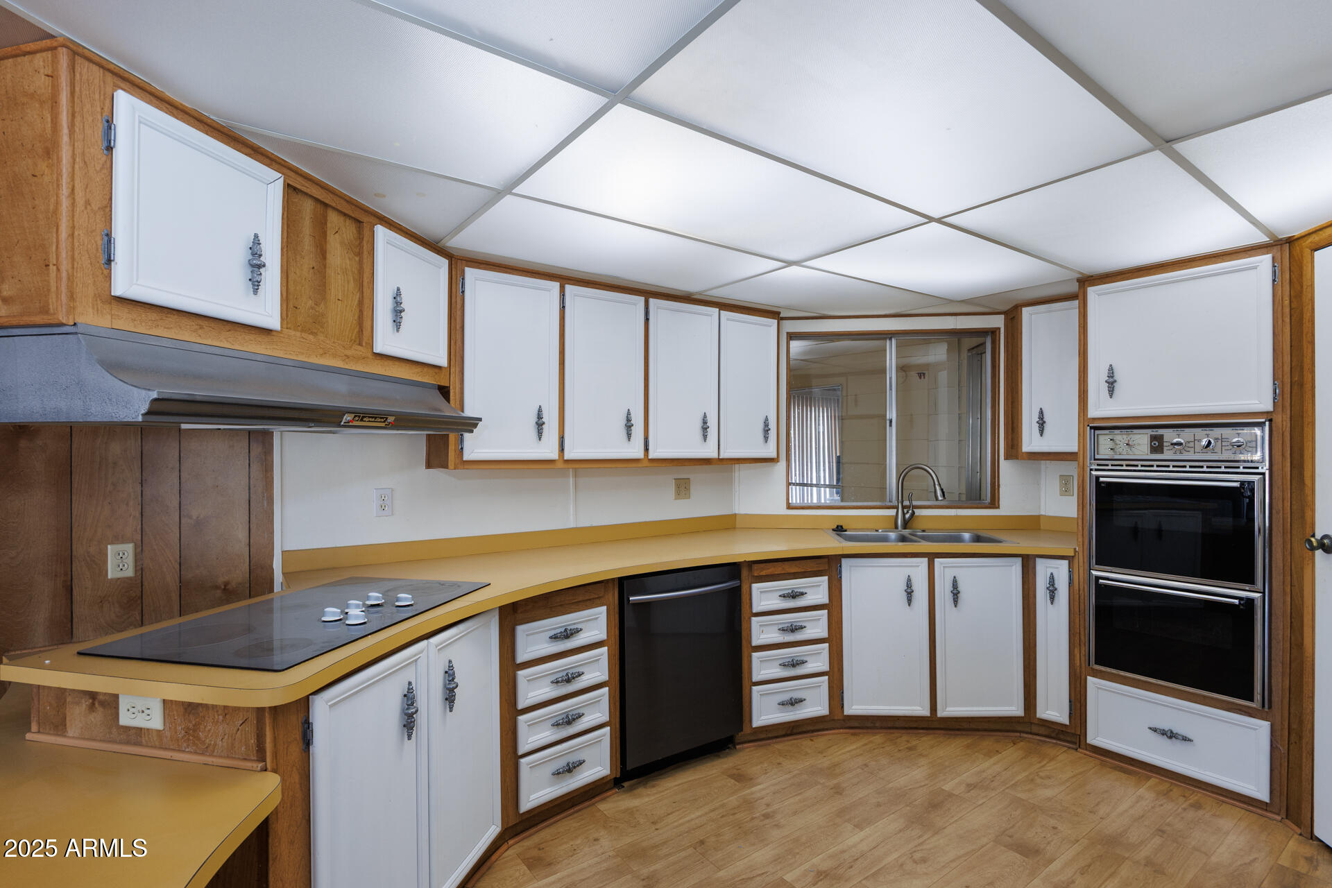 2100 North Trekell Road, Unit 144 Casa Grande, AZ 85122 - Photo 9 of 36 a kitchen with stainless steel appliances granite countertop a stove and a sink