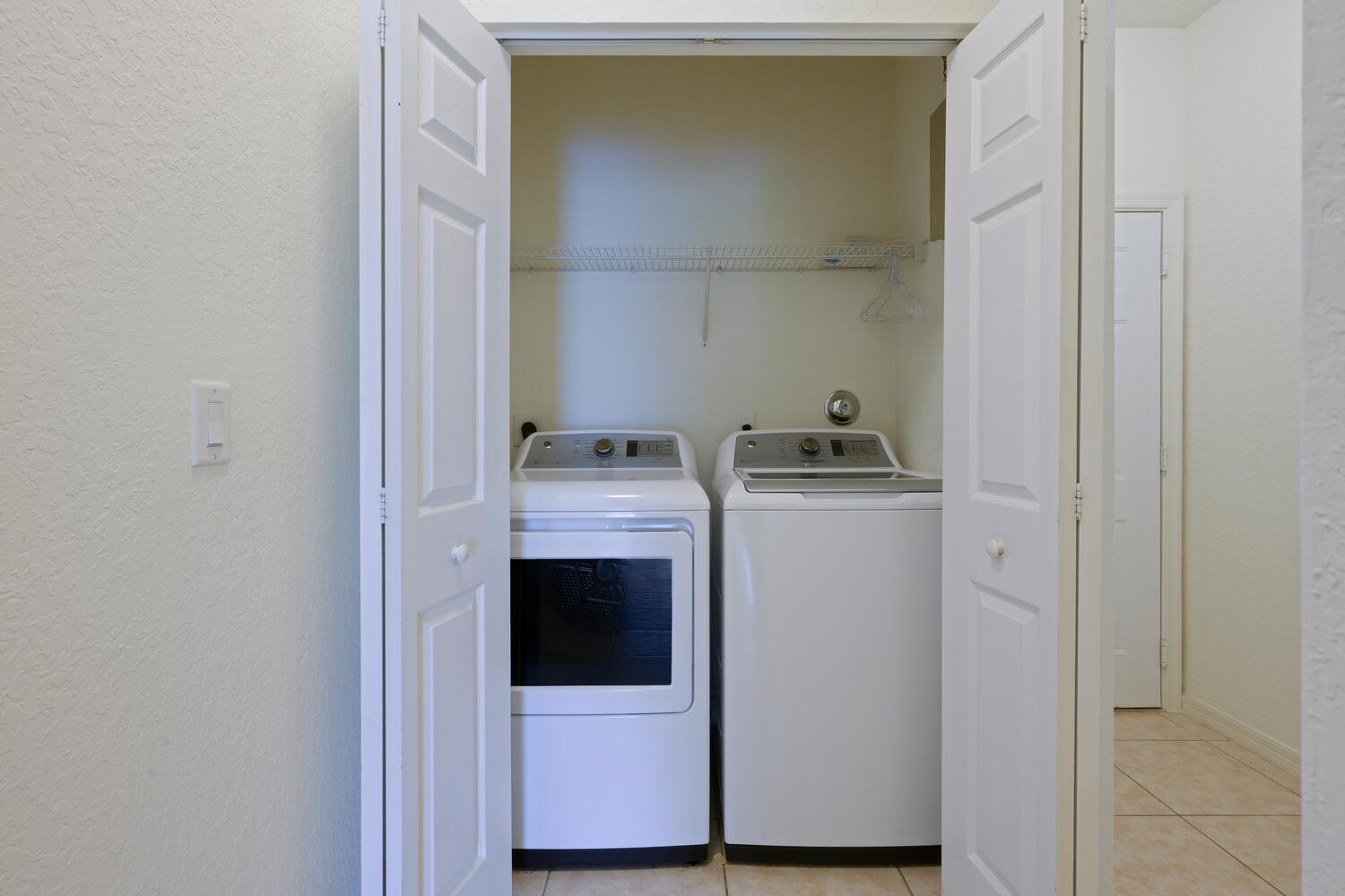 1561 Southeast Hampshire Way, Unit 104 Stuart, FL 34994 - Photo 19 of 23 a room with storage and utility