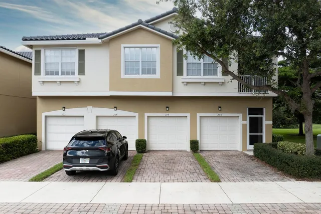 a car parked in front of a white building