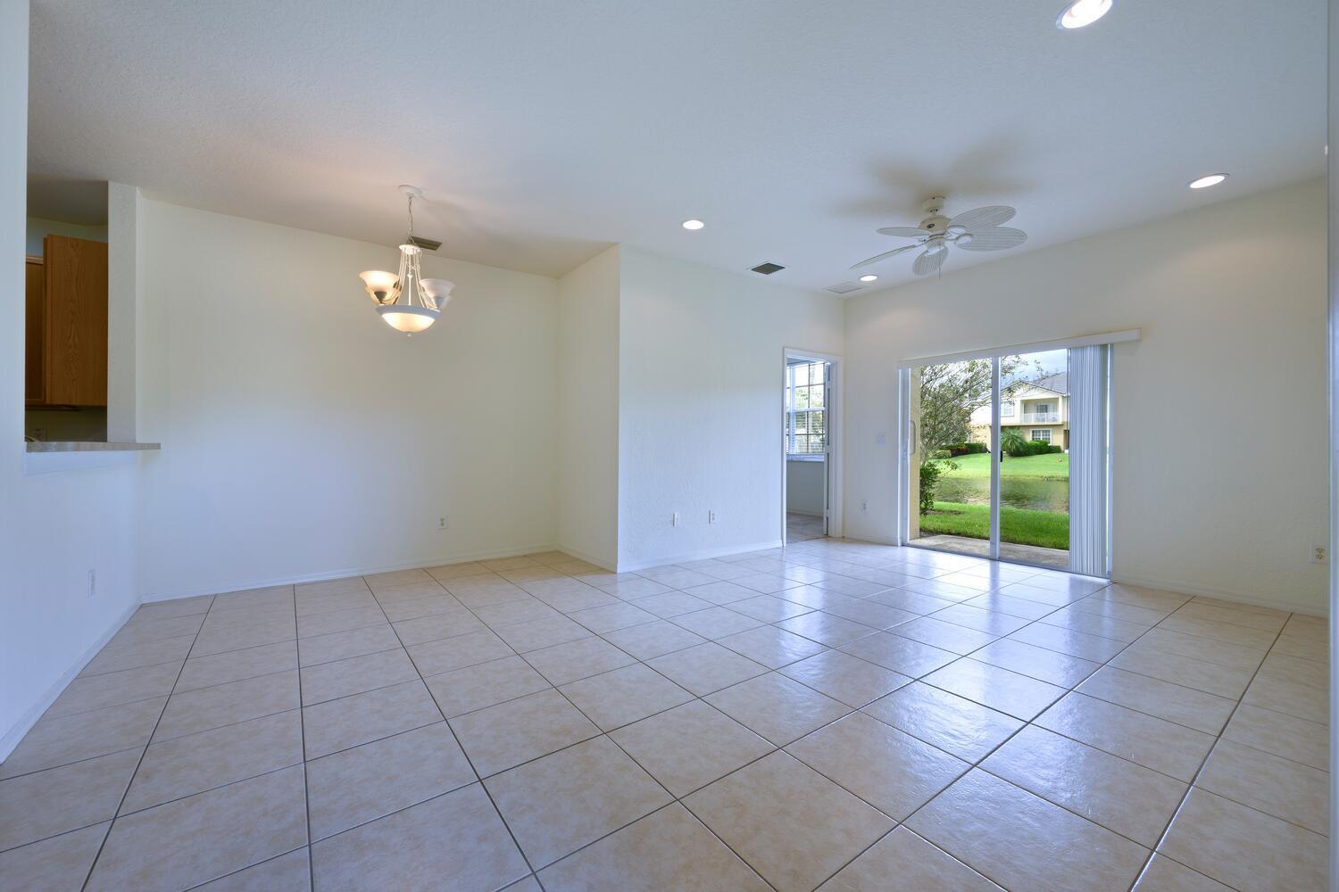 1561 Southeast Hampshire Way, Unit 104 Stuart, FL 34994 - Photo 5 of 23 a view of an empty room with a window