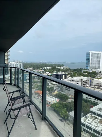a view of a balcony with wooden floor