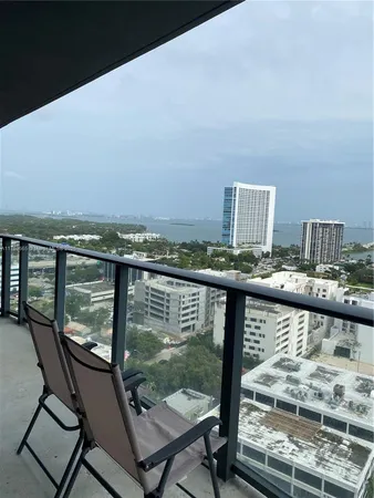 a view of a balcony with wooden floor