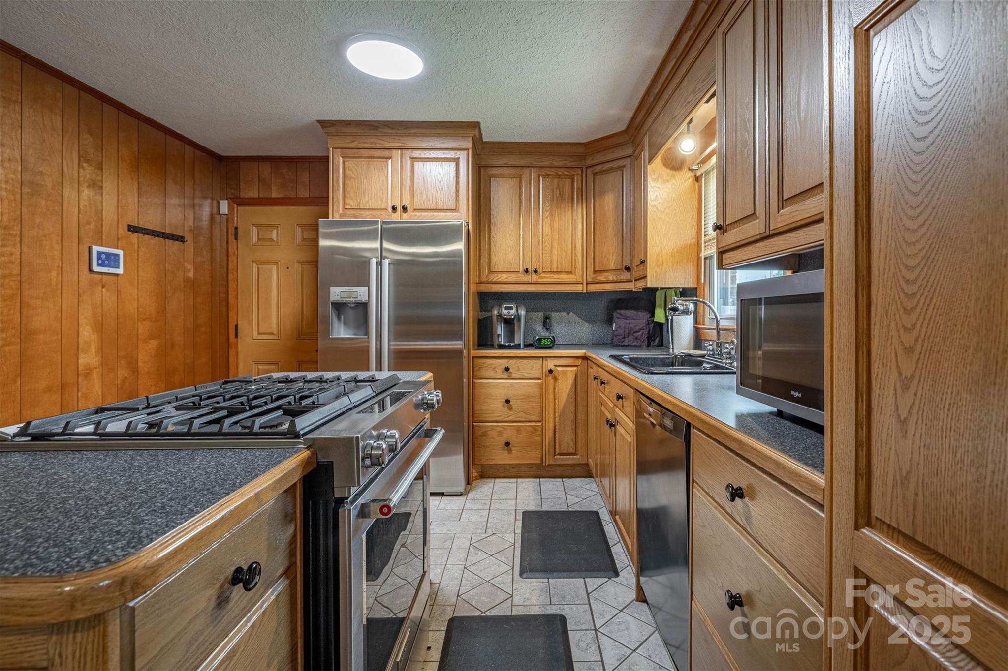 106 Gerald Road Morganton, NC 28655 - Photo 12 of 30 a kitchen with a sink stove and cabinets