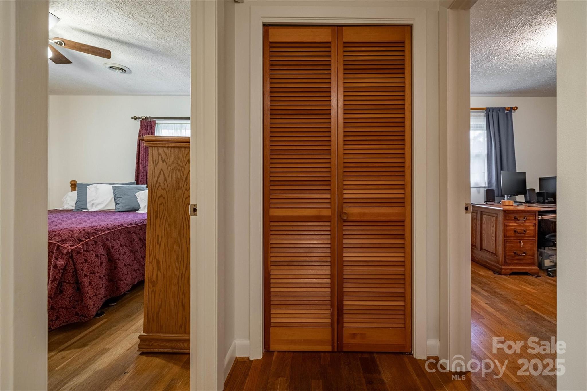 106 Gerald Road Morganton, NC 28655 - Photo 17 of 30 a view of a hallway with wooden floor and a bathroom