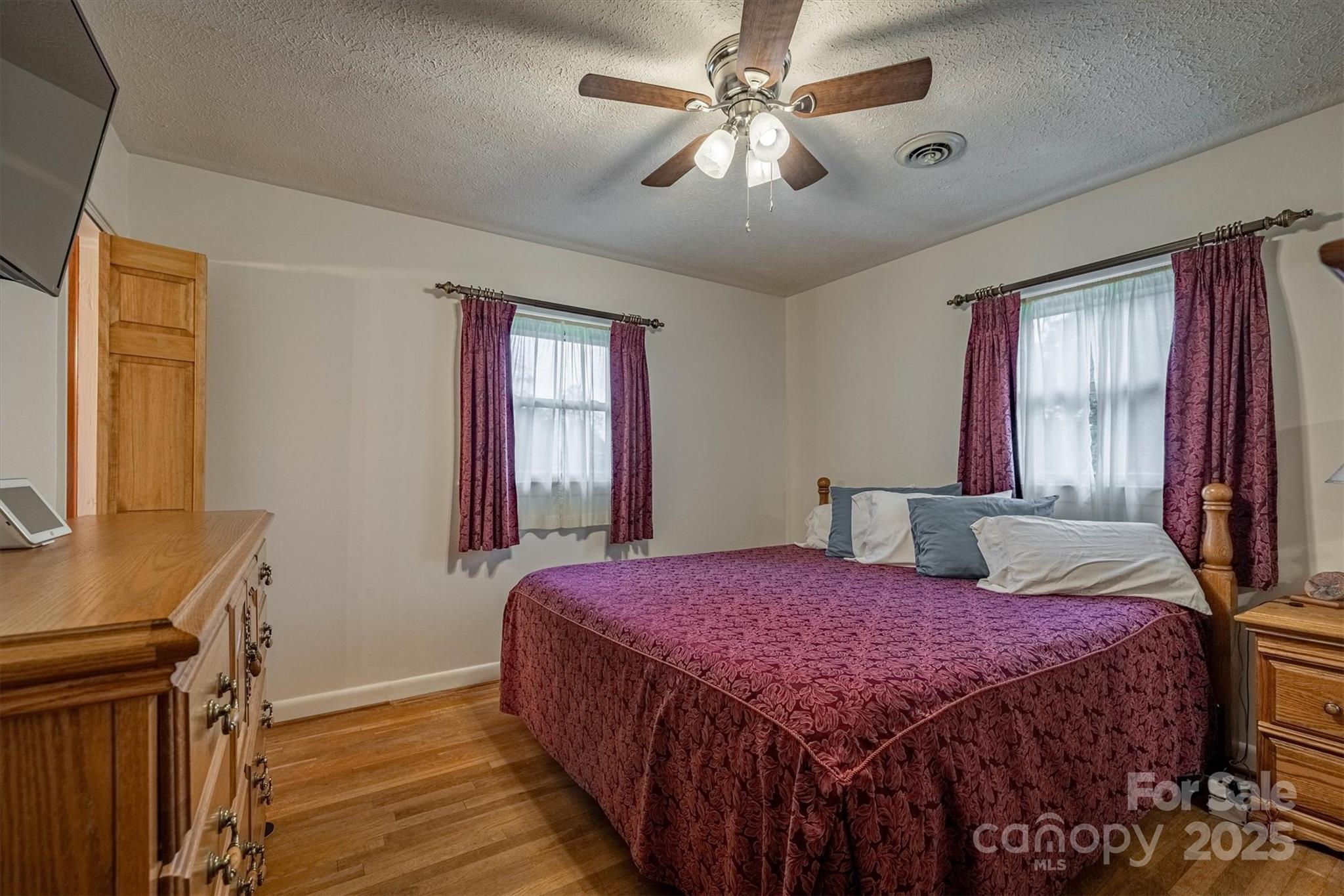 106 Gerald Road Morganton, NC 28655 - Photo 18 of 30 a bedroom with a large bed and a window