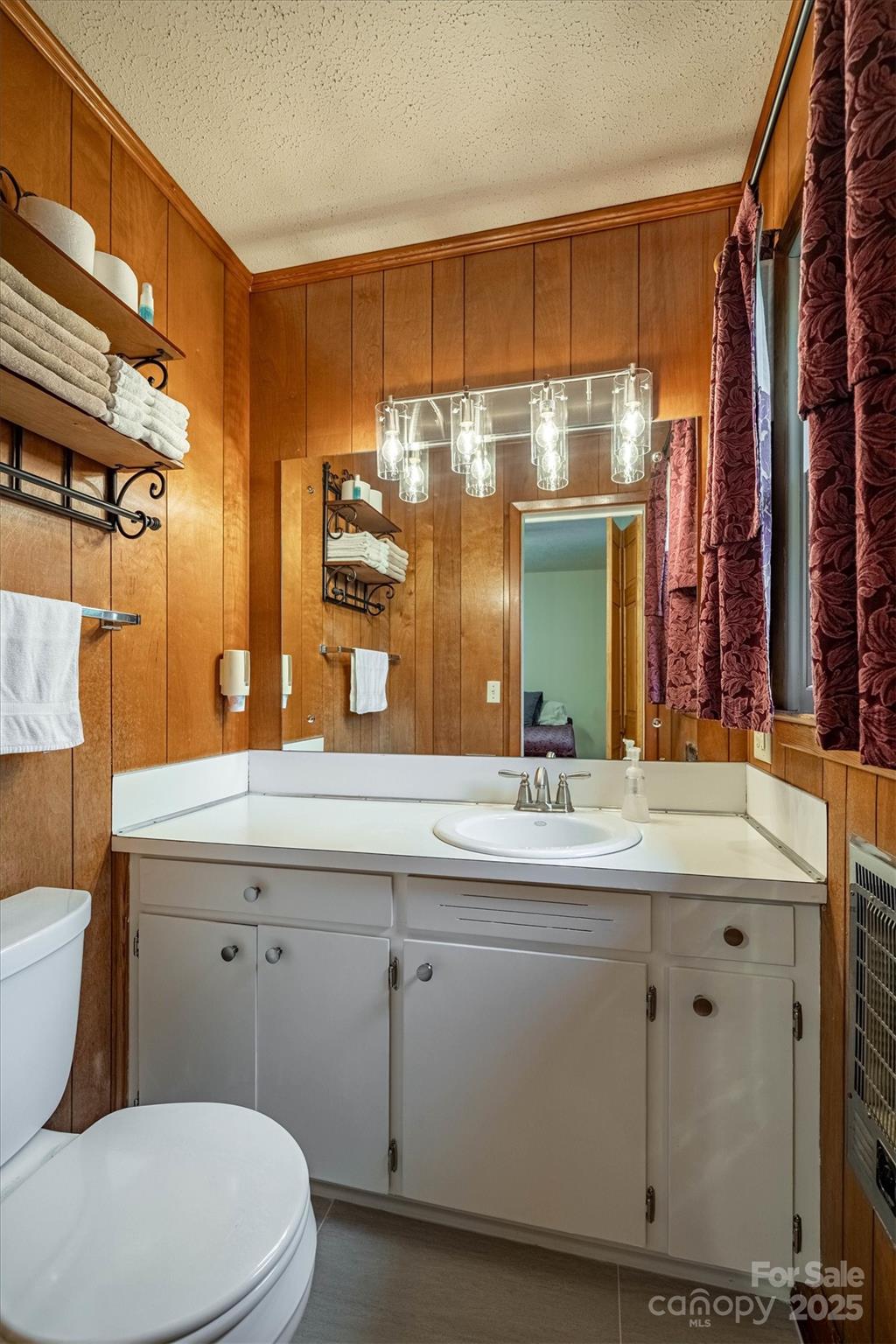 106 Gerald Road Morganton, NC 28655 - Photo 19 of 30 a bathroom with a sink a toilet and a mirror