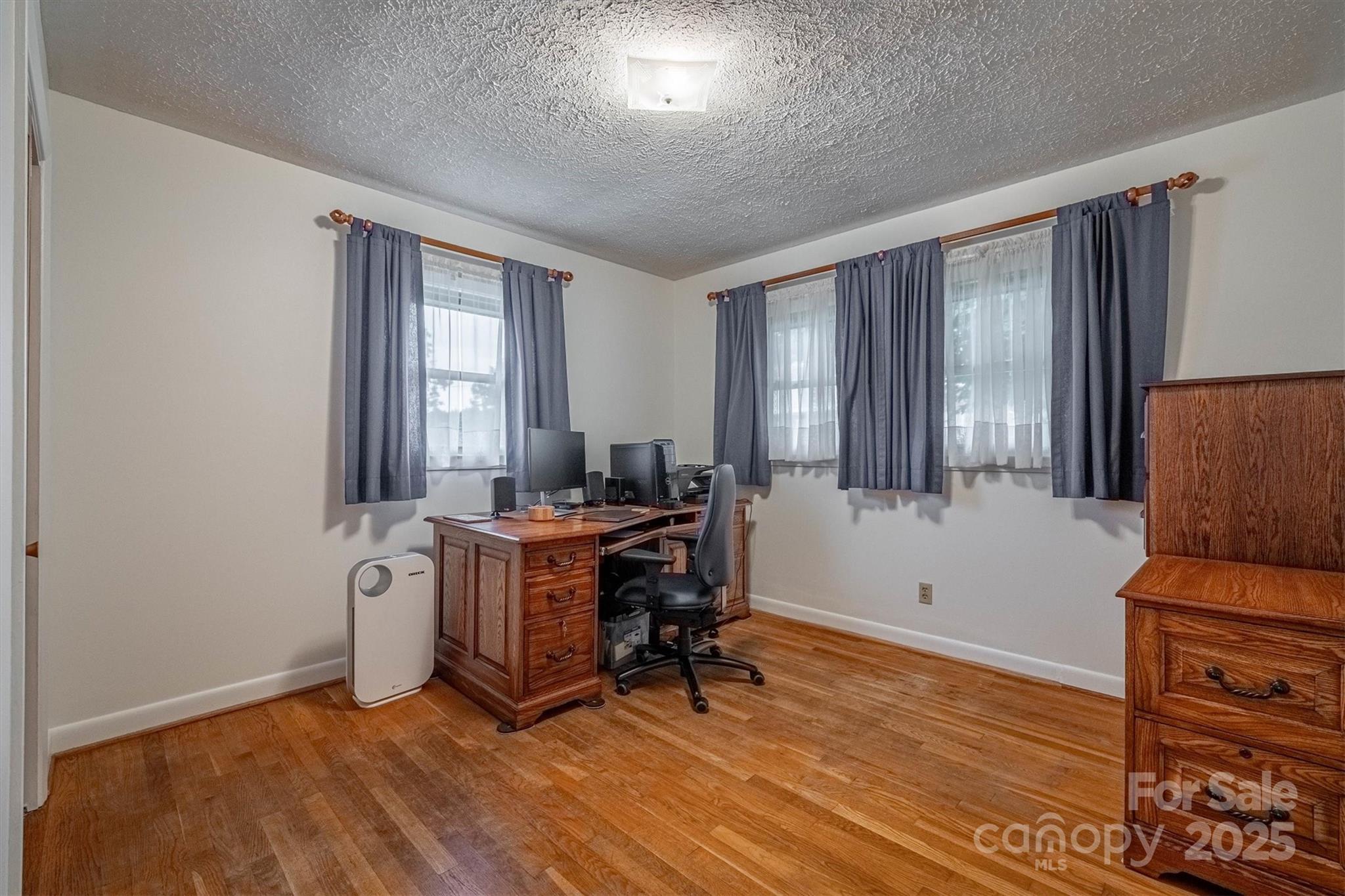 106 Gerald Road Morganton, NC 28655 - Photo 20 of 30 a view of workspace with wooden floor and windows