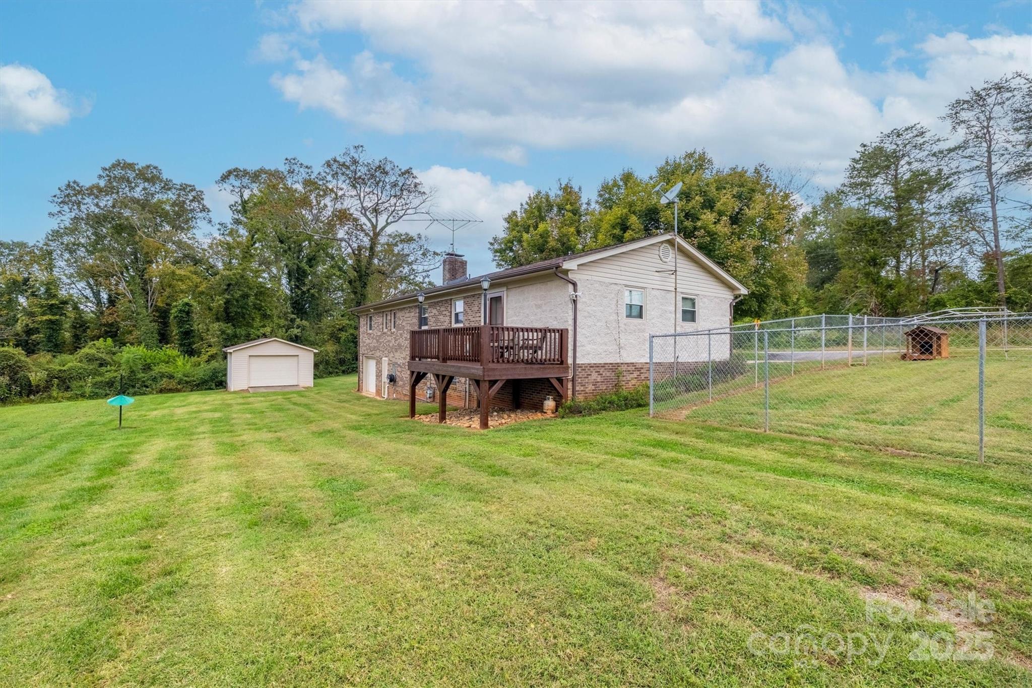 106 Gerald Road Morganton, NC 28655 - Photo 5 of 30 a front view of a house with a yard and trees