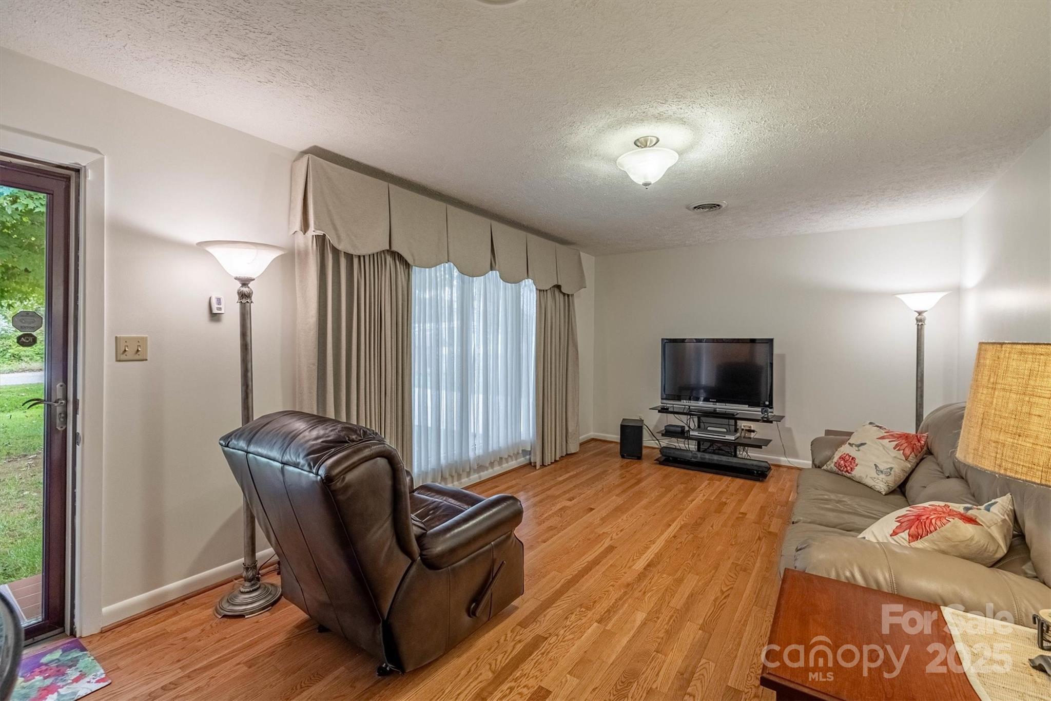 106 Gerald Road Morganton, NC 28655 - Photo 7 of 30 a living room with furniture and a flat screen tv