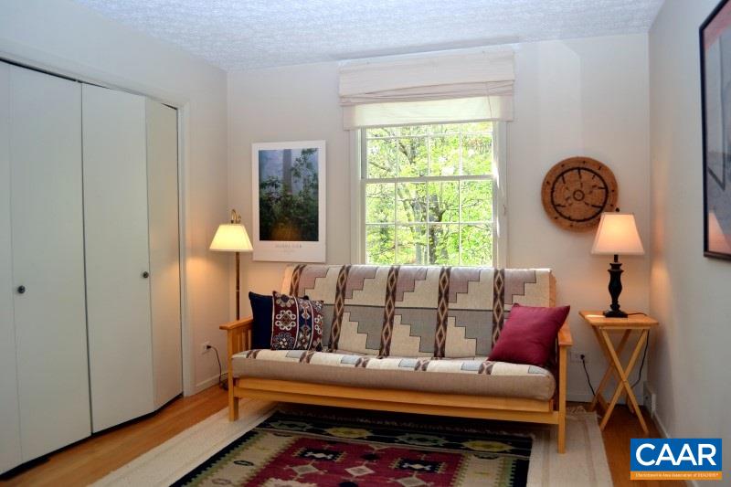1503 Rugby Road Charlottesville, VA 22903 - Photo 17 of 40 a living room with furniture and a window