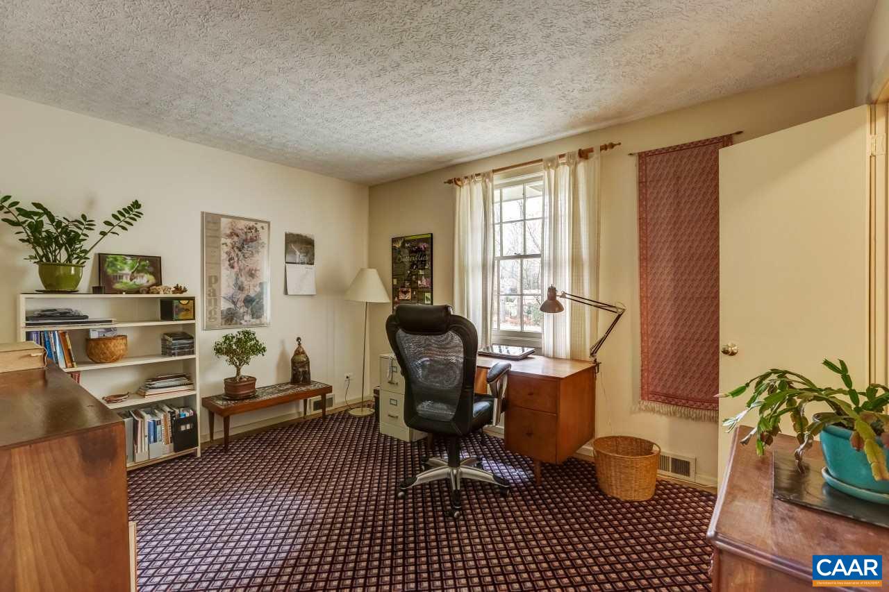 1503 Rugby Road Charlottesville, VA 22903 - Photo 18 of 40 a view of a workspace with furniture and a window